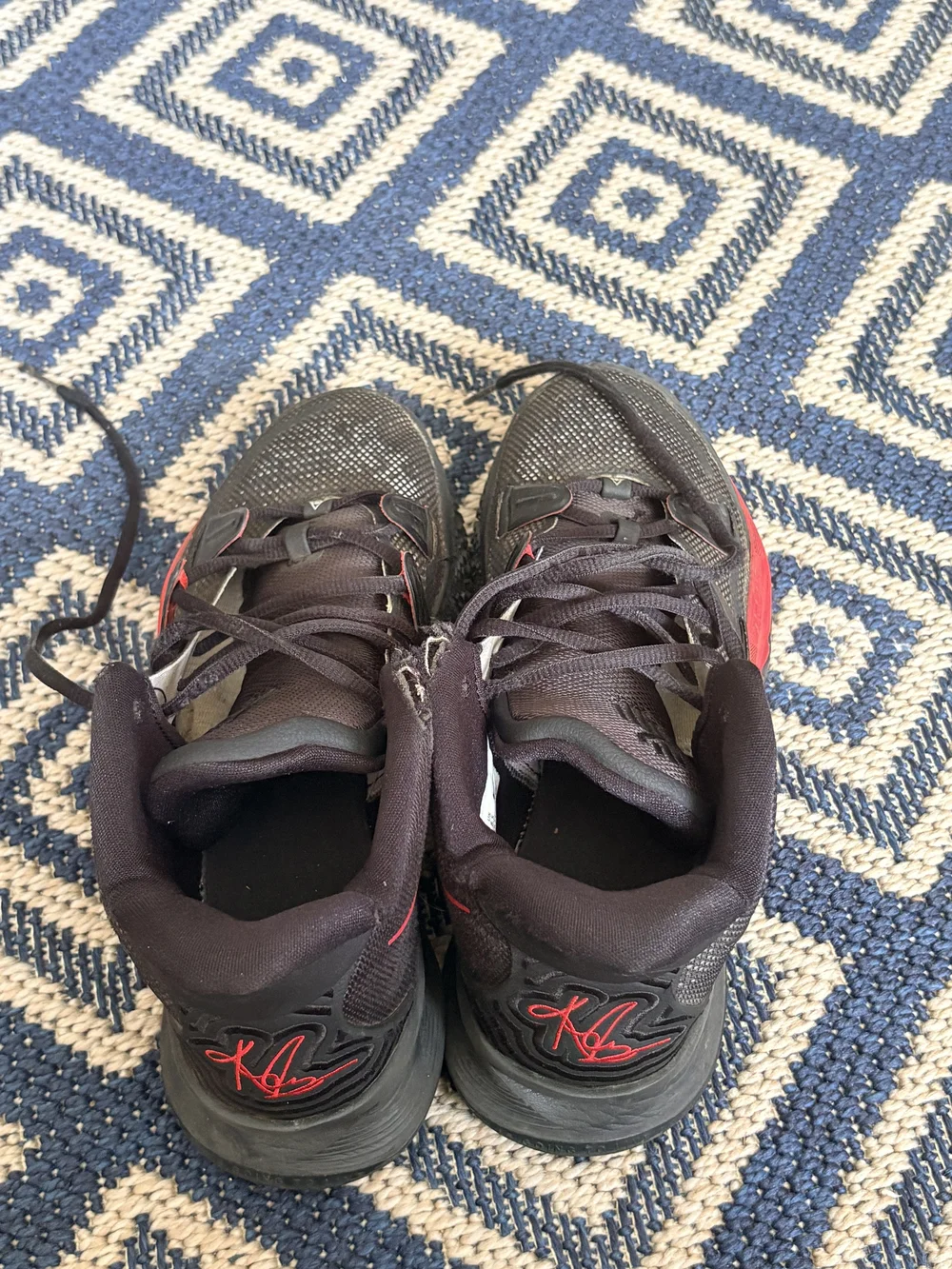 Nike Men's Black Athletic Shoes with Red Accents